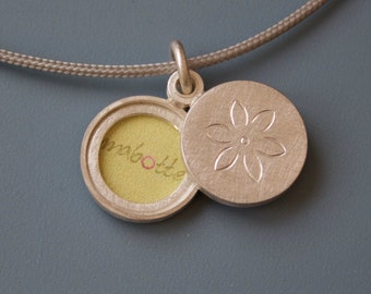 small sterling silver locket for two pictures with dainty flower
