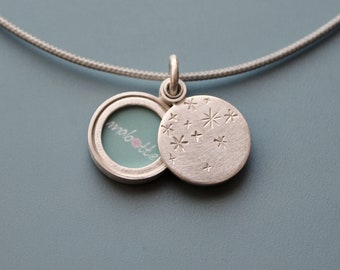 small locket with starry night design in sterling silver