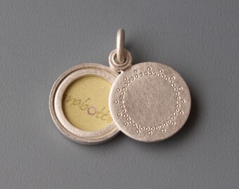 elegant silver locket for one picture with delicate lace pattern