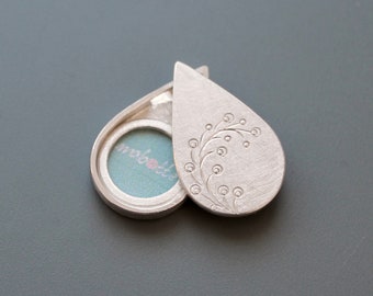 teardrop sterling silver photo locket with twig design