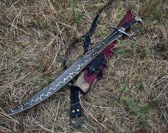 May include: A curved sword with a dark, patterned Damascus steel blade featuring a prominent wavy line along the edge. The sword has a dark handle and is paired with a deep red scabbard that includes ornate metal accents and a black leather strap.