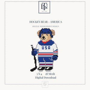 May include: A digital needlepoint design titled HOCKEY BEAR - AMERICA featuring a bear wearing a blue hockey helmet, a white jersey with USA in blue text, blue pants, and blue gloves, holding a black hockey stick. Dimensions are 3 x 4 inches.