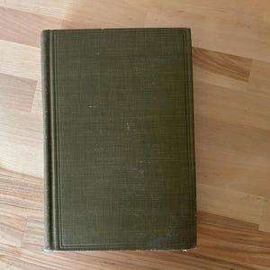 May include: A rustic wooden sign with the text "Welcome to our home" in white lettering. The sign features a distressed finish and a simple, inviting design, perfect for a front porch or entryway.