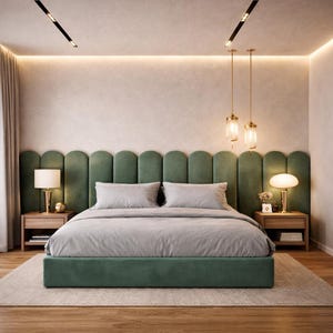 May include: A contemporary bedroom with a green upholstered bed and headboard. The bed is dressed with grey bedding and has wooden bedside tables with lamps. Two pendant lights hang above the bed, and the room has a neutral colour scheme.