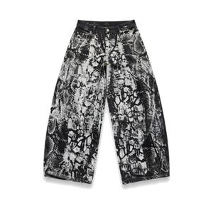 May include: Wide-leg denim pants featuring a high-waisted design with a button and zipper fly closure. The fabric displays a high-contrast black and white snakeskin-inspired print throughout, with curved seam detailing along the front legs.