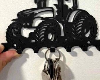 Tractor silhouette style key hanger boys room. In black