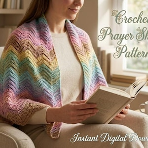 May include: A crochet prayer shawl featuring a multi-colored chevron pattern in shades of pink, blue, yellow, and tan. The text Crochet Prayer Shawl Pattern and Instant Digital Download is visible on the image.
