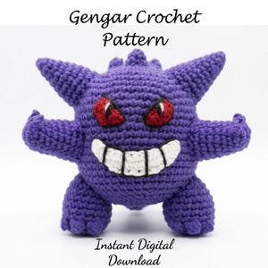May include: A purple crochet Gengar plush toy with red eyes and a wide white grin featuring black teeth. The text Gengar Crochet Pattern is at the top and Instant Digital Download is at the bottom of the image against a plain white background.
