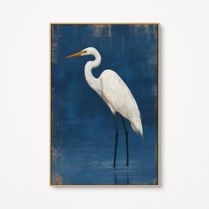 May include: A set of three ceramic mugs with a speckled, cream-colored glaze. Each mug features a different hand-painted floral design in shades of blue, green, and yellow. The mugs have a simple, rounded shape and a comfortable handle.