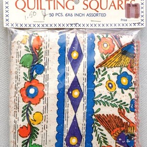 May include: A package of assorted quilting squares. The package contains 50 pieces, each measuring 6x6 inches. The fabric features colorful floral and geometric patterns in shades of orange, blue, yellow, and green on a cream background.