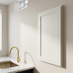 May include: A rectangular white cabinet door with a flat center panel and a raised frame border, mounted vertically on a wall. The door features a smooth, matte finish and clean, straight edges, presenting a simple and functional design element.