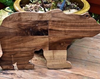 This bear is a beautiful addition to any home. All of the wood is recycled walnut wood - the backing is not.