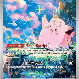 May include: A Clefairy Pokémon trading card with a pink Clefairy character. The card features a colorful background with text that reads "Moon Barrier" and "Fairy Wind". The card has a HP of 70.