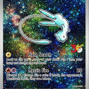 May include: A Shining Mew Pokémon trading card with a light blue creature illustration on a starry background. The card features text including "Flash Search" and "Mystic Fire". The HP is 50.