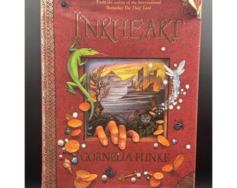 "CORAZÓN DE TINTA" de Cornelia Funke / Tapa dura, con sobrecubierta. Primera edición estadounidense de 2003.