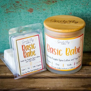 May include: A candle and wax melt set with the text "Basic Babe." The candle is in a glass jar with a wooden lid. The wax melts are in a clear plastic container. The candle and wax melts are scented with pumpkin spice latte and yoga pants.