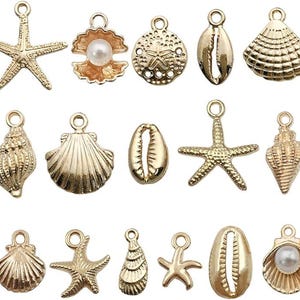 May include: A collection of gold-colored seashell charms, including starfish, scallop shells, and conch shells. Some charms feature a pearl. These charms are ideal for jewelry making or crafting projects with a beach or nautical theme.