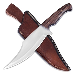 May include: A large, stainless steel knife with a dark wood handle and a brown leather sheath. The knife has a curved blade and is designed for outdoor use. The sheath has decorative stitching.
