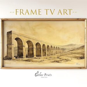 May include: A framed print of a sepia-toned aqueduct, featuring a series of arches stretching into the distance. The artwork is set against a pale yellow background, with the text "-FRAME TV ART-" at the top and "Gather Prints" at the bottom.