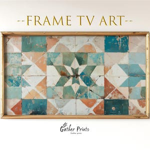 Op de afbeelding: Een ingelijst tv-kunstwerk met een geometrisch patroon in tinten van teal, oranje en wit. Het kunstwerk is ingesloten in een goudkleurige lijst. De tekst "-FRAME TV ART-" staat bovenaan en "Gather Prints" onderaan.