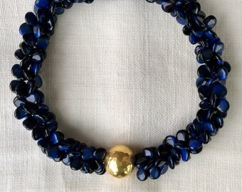 Lapis and vermeil double petals .  Glass strands with sterling silver hammered bead . statement necklace