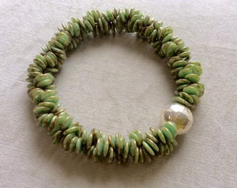 antique olivine double disks . double disk strands with sterling silver hammered bead . statement necklace