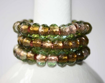 peridot green with golden copper foil or aquamarine with silver foil glass stretch cord bracelet . one bracelt