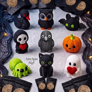 May include: A collection of nine small textured Halloween-themed figures including a black duck, owl, bat, skull, crow, orange pumpkin, green spider, black cat, and white ghost, accompanied by black mystery bags labeled Halloween Mystery Bag.