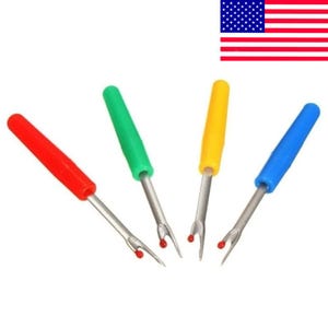 May include: Four seam rippers with colorful handles: red, green, yellow, and blue. Each tool has a silver metal blade with a red safety ball at the tip. These tools are used for removing stitches from fabric.