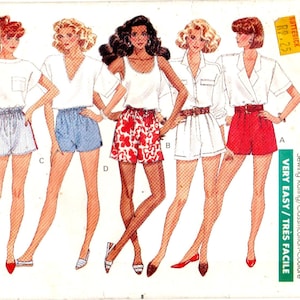 Puede incluir: Patrón Butterick 6466 para pantalones cortos. El patrón presenta ilustraciones de pantalones cortos en varios estilos, incluyendo rojo, azul y blanco. El texto en el patrón dice "Fast & Easy" y "Very Easy".