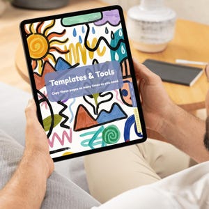 May include: A person holding a tablet displaying a colorful digital art piece with the text "Templates & Tools". The artwork features a sun, mountains, and abstract shapes in various colors, including blue, orange, and green.