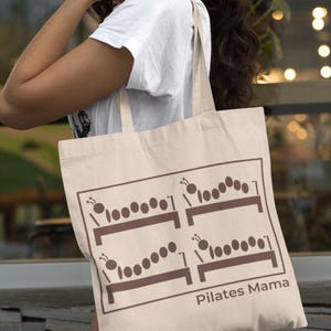 May include: A white ceramic mug with a black handle and the text "But First, Coffee" in a handwritten style. The mug is on a white surface. The mug is approximately 4 inches tall.