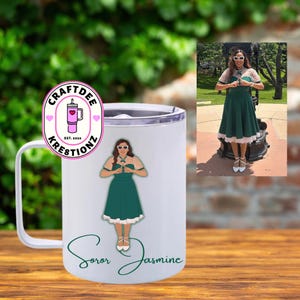 May include: White travel mug with a silver rim and handle. The mug features a graphic of a woman in a green dress and the words "Soror Jasmine." The mug also has a logo that says "Craftdee Krestionz."