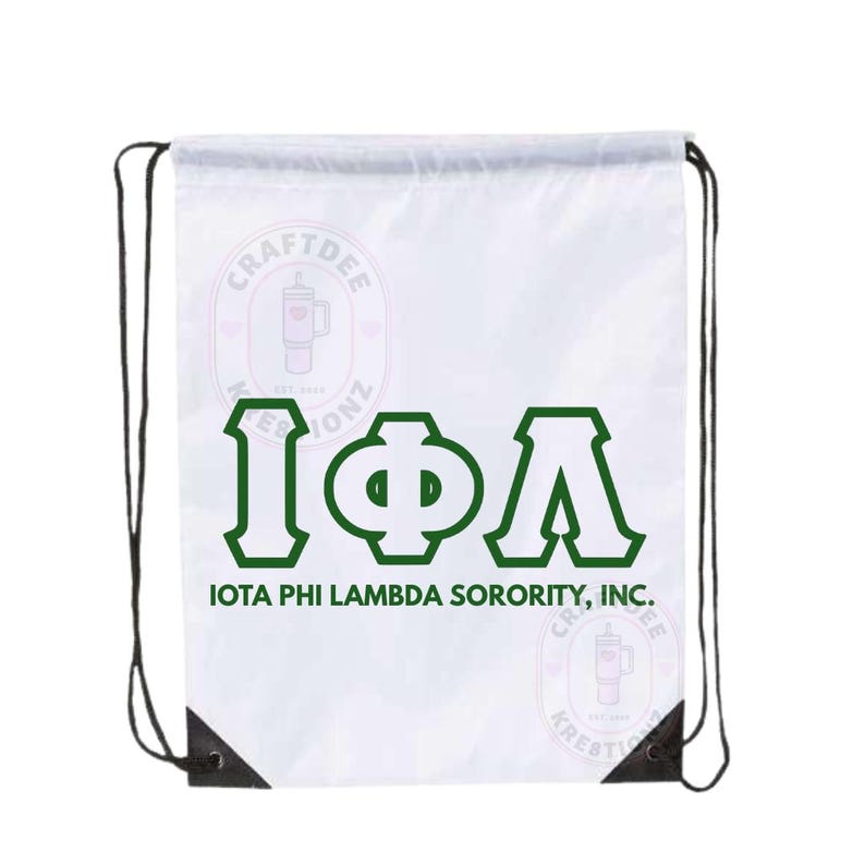 May include: White drawstring bag with black drawstrings and reinforced corners. The bag features the Greek letters I&Phi;&Lambda; in green, with the text "IOTA PHI LAMBDA SORORITY, INC." below. The bag also has two circular logos with text and a graphic of a tumbler.