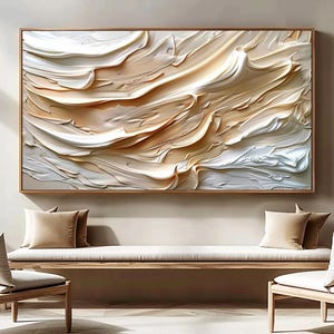 Peut inclure: Tableau abstrait avec un design texturé et superposé dans des tons de blanc, beige et marron clair. L'œuvre est encadrée dans un cadre en bois marron clair. Il est affiché au-dessus d'un banc en bois avec deux coussins beiges.