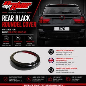 May include: A gloss black circular roundel cover designed for the rear emblem of a BMW X5 E70 model from 2007 to 2013. The accessory features a smooth, reflective finish and includes pre-applied adhesive tape on the interior rim for installation.