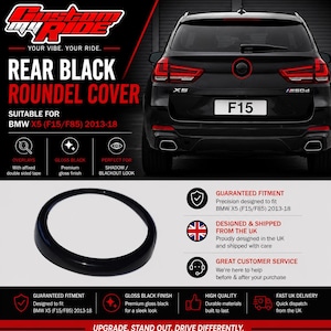 May include: A circular, gloss black roundel cover designed for the rear emblem of a BMW X5 F15/F85 model from 2013-2018. The product features a smooth, reflective finish and is intended to be applied as an overlay with double-sided tape.