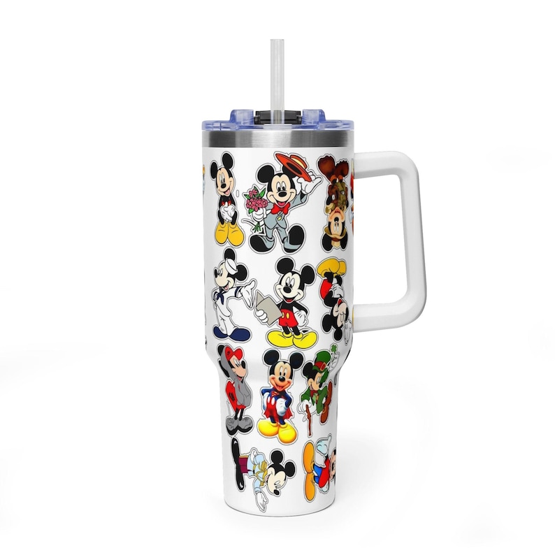 May include: A white stainless steel tumbler with a handle and a clear straw, featuring a repeating pattern of various Mickey Mouse illustrations in different outfits and poses, including a sailor suit, a tuxedo, and a green hat, against a white background.