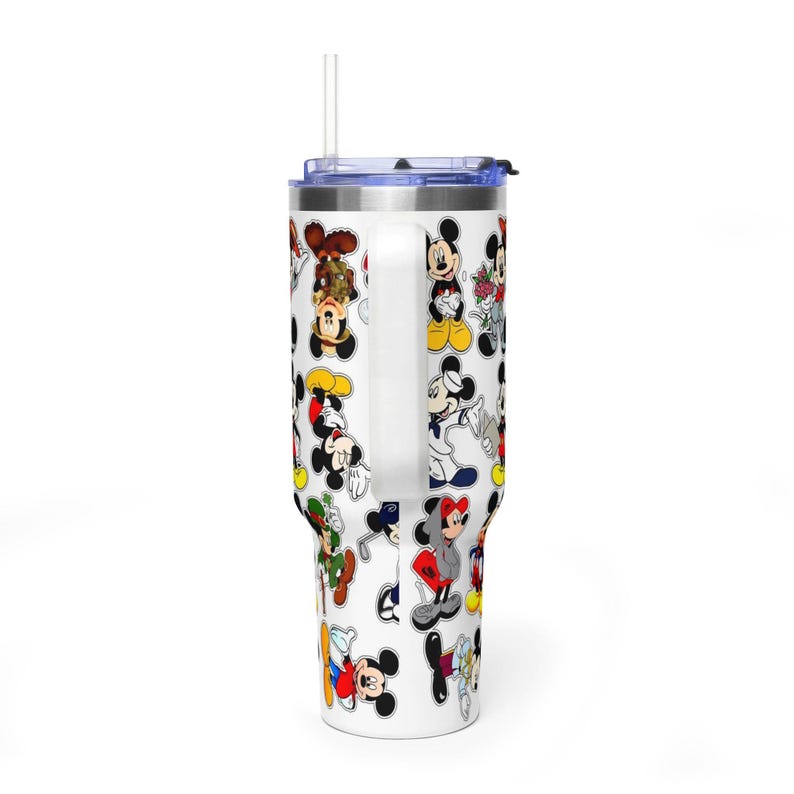 May include: A white stainless steel tumbler with a handle and a clear straw, featuring a repeating pattern of various Mickey Mouse illustrations in different outfits and poses, including a sailor suit, a hoodie, and a green hat, against a white background.