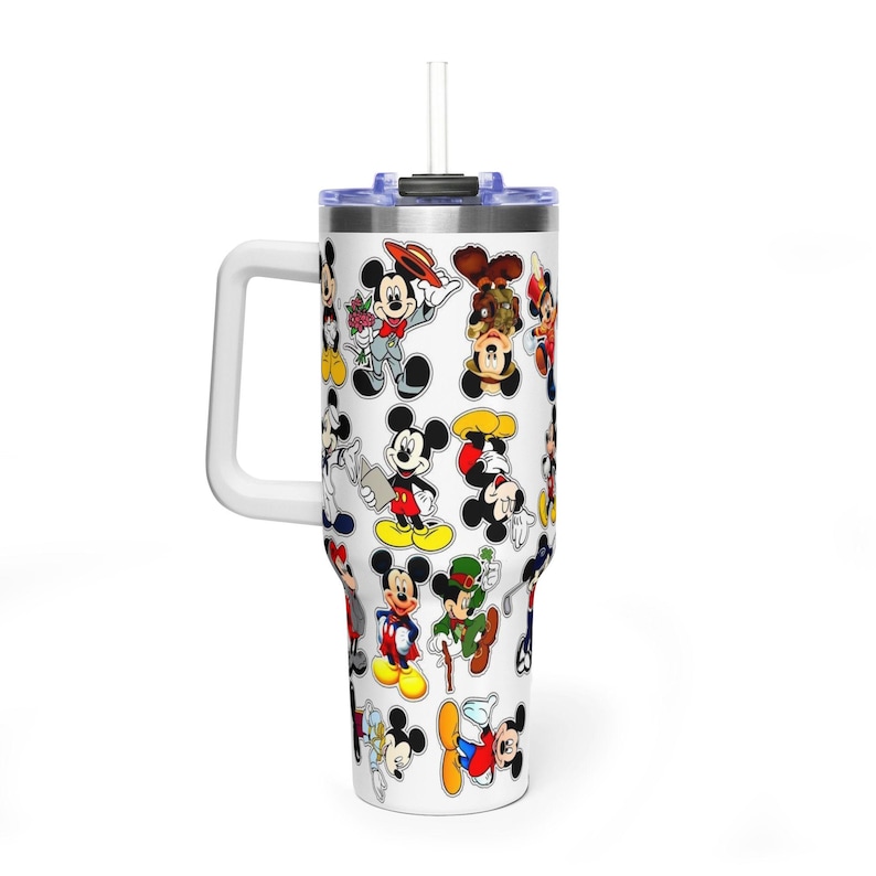 May include: A white stainless steel tumbler with a handle and a clear straw, featuring a repeating pattern of various Mickey Mouse illustrations in red, yellow, black, and green colors, including Mickey in different outfits and poses on a white background.