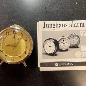 May include: A set of three ceramic mugs with a speckled, matte finish. The mugs are in shades of cream, light gray, and dark gray. Each mug has a simple, minimalist design, perfect for coffee or tea.