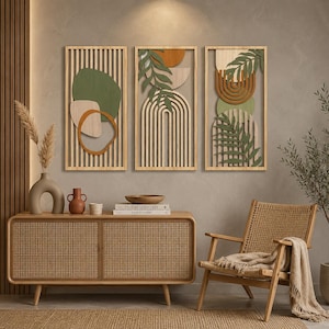 May include: Three wooden wall art panels with abstract designs. Each panel has a light wood frame with a vertical slat background. The designs include geometric shapes and leaf cutouts in shades of green, orange, and beige, creating a modern, natural aesthetic.
