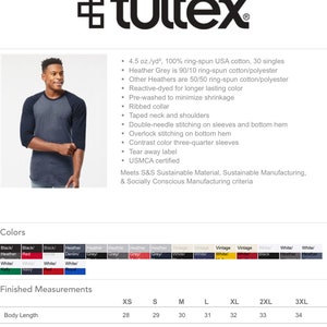 May include: A unisex raglan T-shirt by Tultex. The shirt is heather grey with navy blue three-quarter sleeves. The image also shows the shirt's features, including a ribbed collar and double-needle stitching. The shirt is available in sizes XS to 3XL.