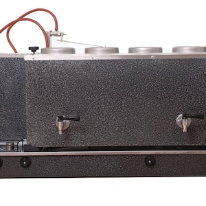 May include: A white ceramic mug with a black handle and the text "But First, Coffee" in a handwritten style. The mug is on a white surface. The mug is approximately 10 cm tall.