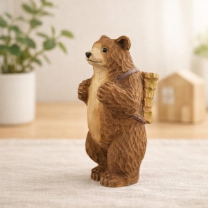 May include: A brown bear figurine with a carved wood texture. The bear is standing upright, with a small backpack on its back. The bear's fur is a mix of light and dark brown, and it has a friendly expression.