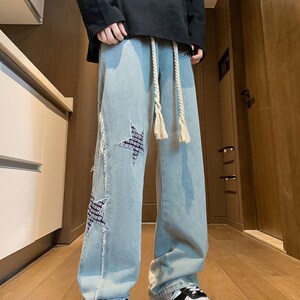 Wide Leg Jeans | Patchwork Graphic Denim Pants | Daily Wear | Y2K Streetwear Style

Wide leg denim jeans with embroidered y2k streetwear style