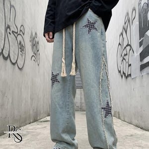Wide Leg Jeans | Patchwork Graphic Denim Pants | Daily Wear | Y2K Streetwear Style

Wide leg denim jeans with embroidered y2k streetwear style