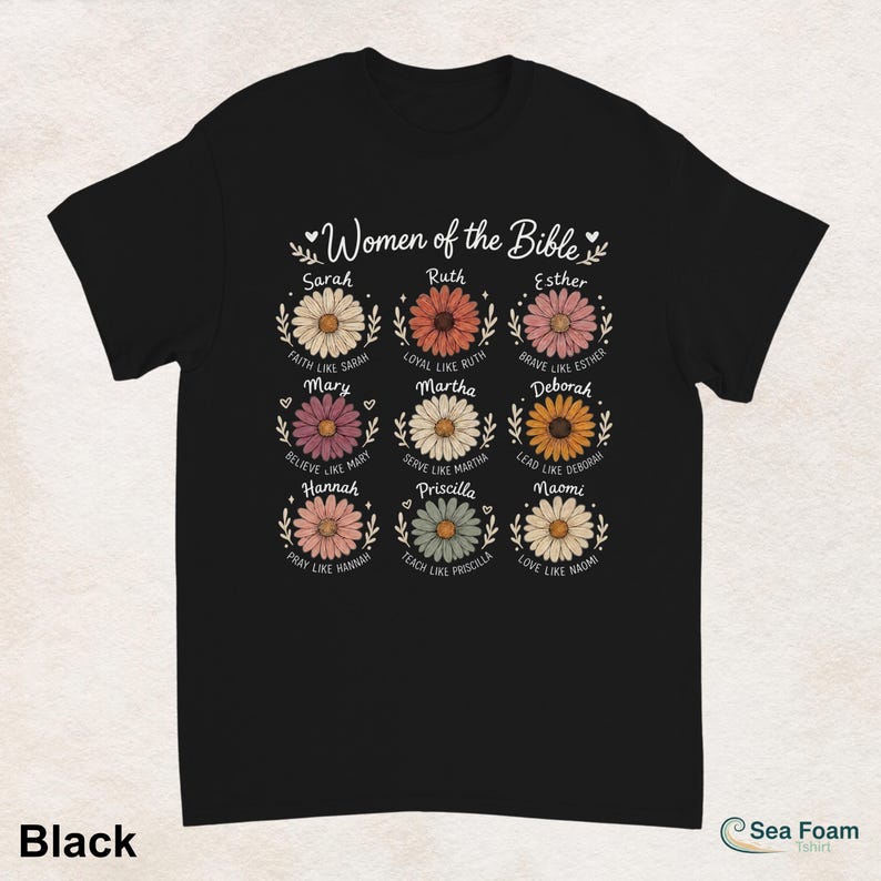 May include: Black t-shirt featuring a floral design with the text "Women of the Bible." Each flower represents a woman from the Bible, with names like Sarah, Ruth, and Esther. The shirt also includes phrases like "Faith like Sarah" and "Love like Naomi."