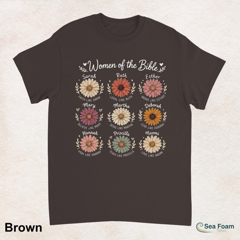 May include: A brown t-shirt featuring the text "Women of the Bible" above nine daisy illustrations, each with a woman's name and a related phrase. The shirt's color is brown.