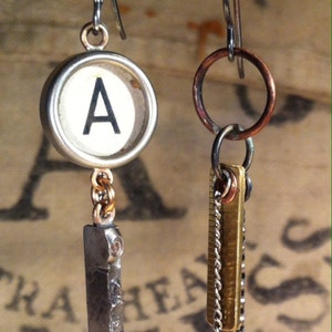 Antique typewriter key earrings, brass rule, crystal, sterling wires. Asymmetric style